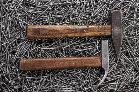 Old hammers and nails on table Stock Photos