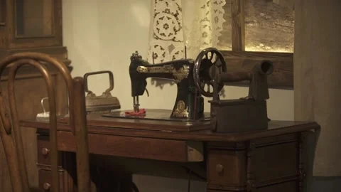Old hand sewing machine stands on the table Stock Footage 150212645