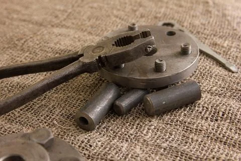 Old hand tools ,Pliers screwdriver wrench rusted iron metal tools on Steel pl Stock Photos