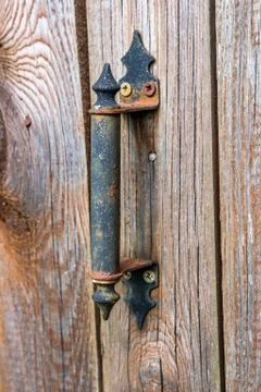 Old handle on the door. Stock Photos