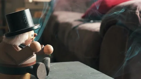 Old handmade antique smoking nutcracker from Germany releasing incense Stock Footage 181036013