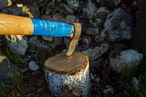 An old handmade axe in the stump Stock Photos