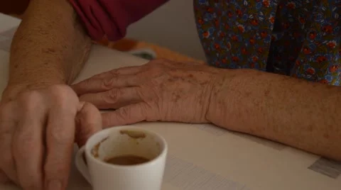 Old hands and coffe cup Stock Footage 43050762