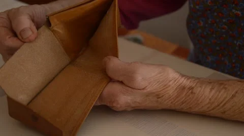 Old hands and empty wallet Stock Footage 43050732