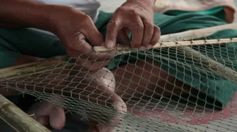 Old hands making fishing nets Stock Footage 10767156