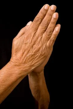 Old hands praying Stock Photos