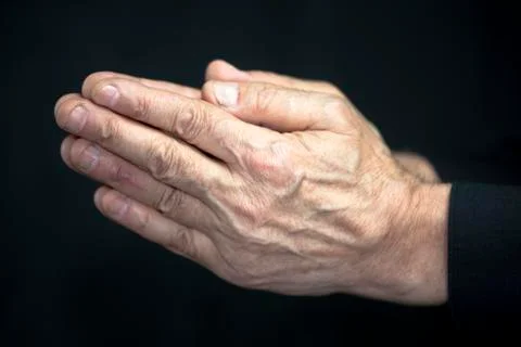 Old hands praying Foto stock