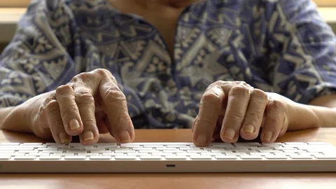 Old hands of senior person operating a tablet computer Stock-Footage 130105257