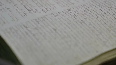 Old handwritten book text close up. Ancient antique literature on brown retro Stock Footage 208849414