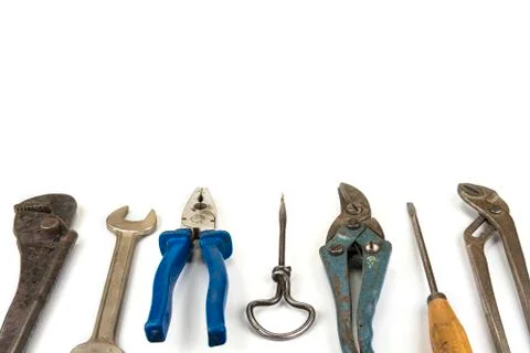 Old handyman tools on the white background Stock Photos
