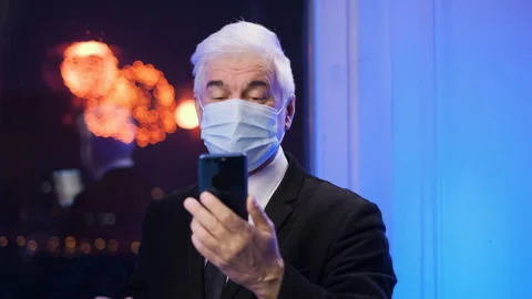 Old happy grey haired man looks at smartphone. Covid relationship at distance. Stock Footage 156066908