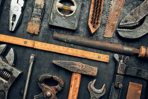 Old hardware tools. Wrench, screwdriver, measure, hammer, pliers on steel s.. Stock Photos
