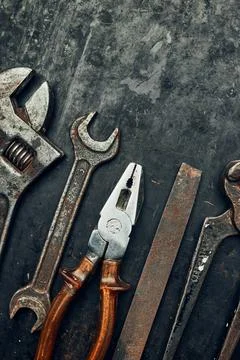 Old hardware tools. Wrench, screwdriver, measure, hammer, pliers on steel s.. Stock Photos