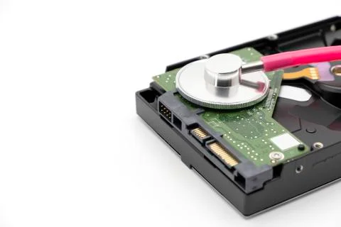 Old HDD or hard disk drive antique storage with pink stethoscope Foto stock