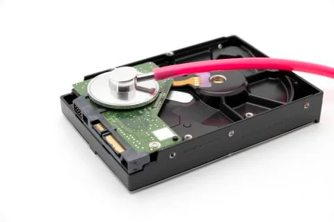 Old HDD or hard disk drive antique storage with pink stethoscope 스톡 사진