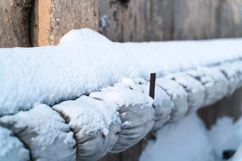 Old heating pipe under the snow Stock Photos