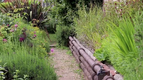 Old heating pipes in garden, pythouse kitchen garden, wiltshire Stock-Footage 137396284