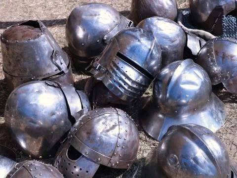Old helmets on the ground Stock Photos