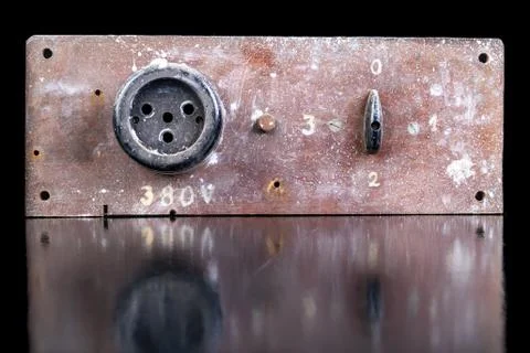 Old high voltage electric socket. Electric board with a controller. Stock Photos