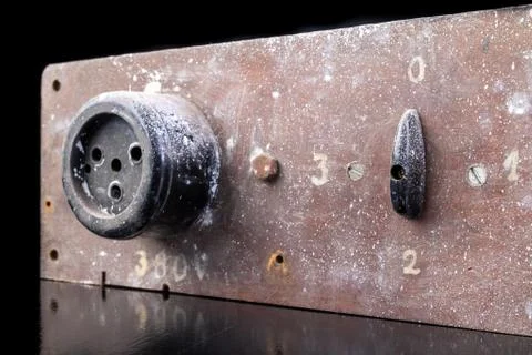 Old high voltage electric socket. Electric board with a controller. Stock Photos