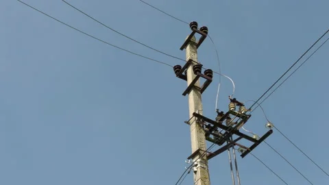 Old High Voltage Power Lines And Power Pylons From Concrete Against The Blue Sky 스톡 동영상 142891917