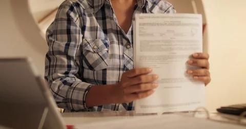 Old Hispanic Woman Filing Forms For Tax Return At Home Stock Footage 85240973