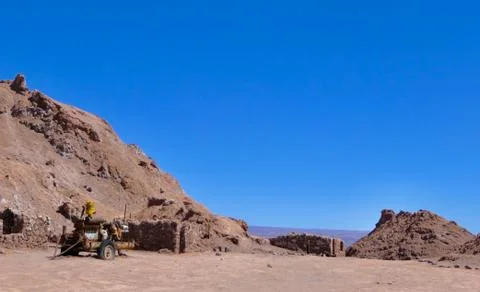 Old historic mine with rusty machine in Atacama salt desert landscape, Chile Stock Photos