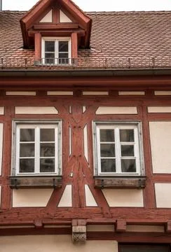 Old historical building and half-timber house with red wood Stock Photos