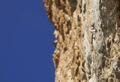 Old hook and surface of natural grungy marble abstract on rocky wall Stock Photos