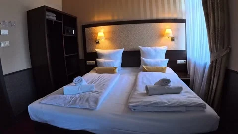 Old hotel room with double bed Stock Footage 274626916