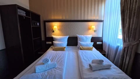 Old hotel room with double bed Stock Footage 274626920