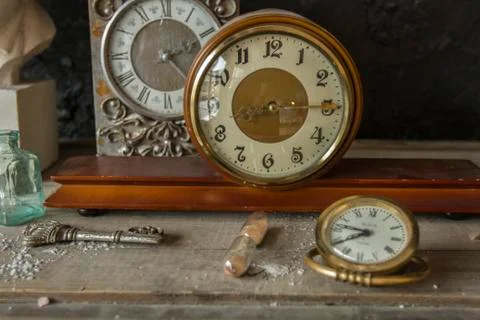 Old hours on a wooden table Stock Photos