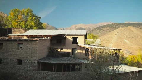 An old house against the backdrop of mountains Stock Footage 225442489