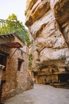 Old house inside the mountain built between rocks Stock Photos