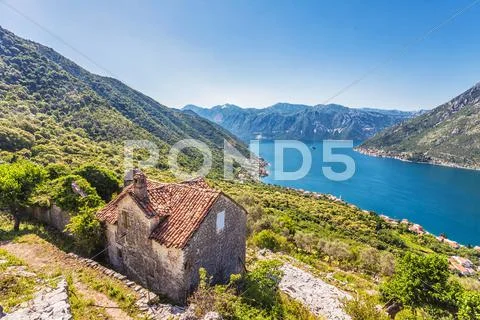 The old house with view on the sea and mountains Stock Photos