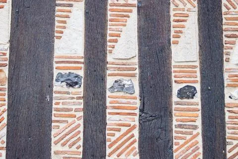 Old house wall with decor elements - brown wooden boards and orange inserts in Stock Photos