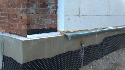 Old  house wall insulation with polystyrene and waterproofing Stock Footage 120668907