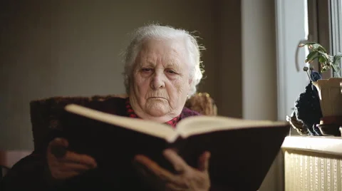Old human reading a book. Stock Footage 43637911
