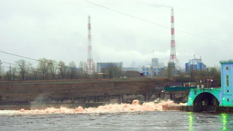 Old hydro station with spray waves in the river Video stock 168884042