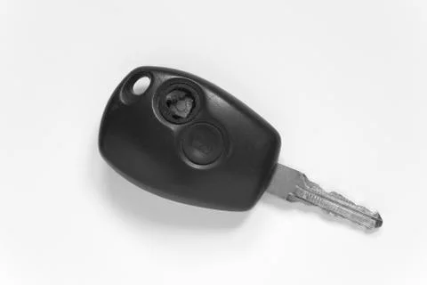 Old ignition key with a broken button. Stock Photos