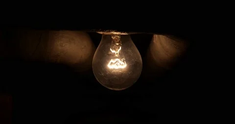 An old incandescent light bulb in the ce... | Stock Video | Pond5