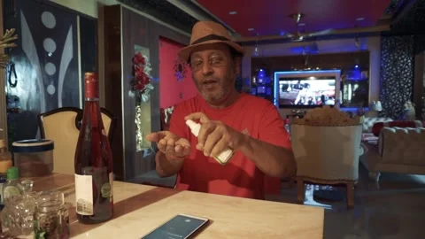 Old Indian Man Sanitizing his hands due to Covid-19 pandemic. Video stock 134971408