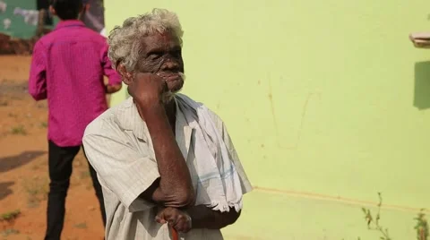Old Indian man without fingers waiting outside Stock Footage 49323069