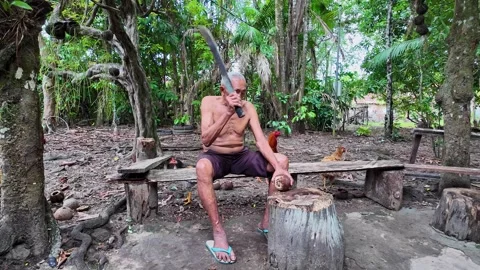 Old indigenous man in the Amazon rainforest at the Guama River in Brazil Stock Footage 302916370
