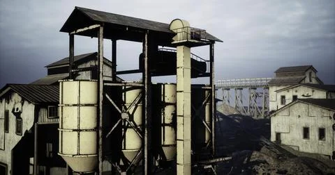Old industrial complex with silos and buildings near a railway track Ilustración de archivo