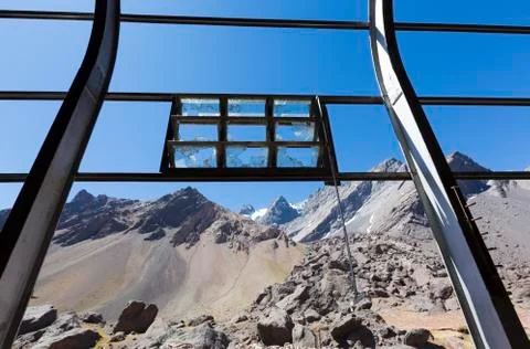 Old Industrial iron window frame and mountains, Argentina Stock Photos