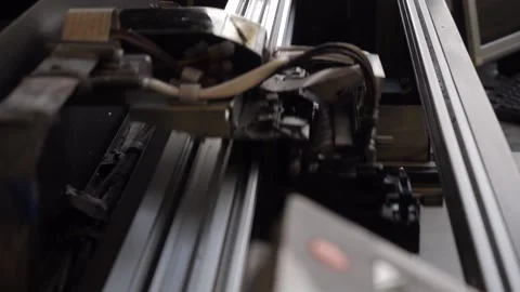 An old industrial printer prints a pattern on fabric Stock Footage 165813272