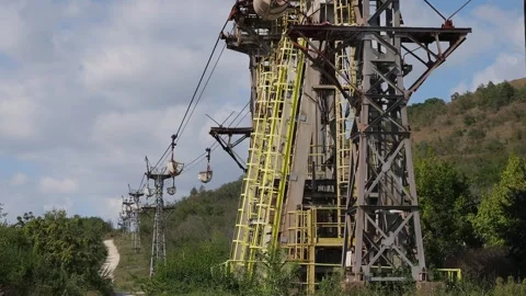 Old industrial ropeway transporting materials in buckets Stock Footage 345927025