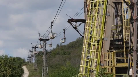 Old industrial ropeway transporting materials in buckets Stock Footage 345927099