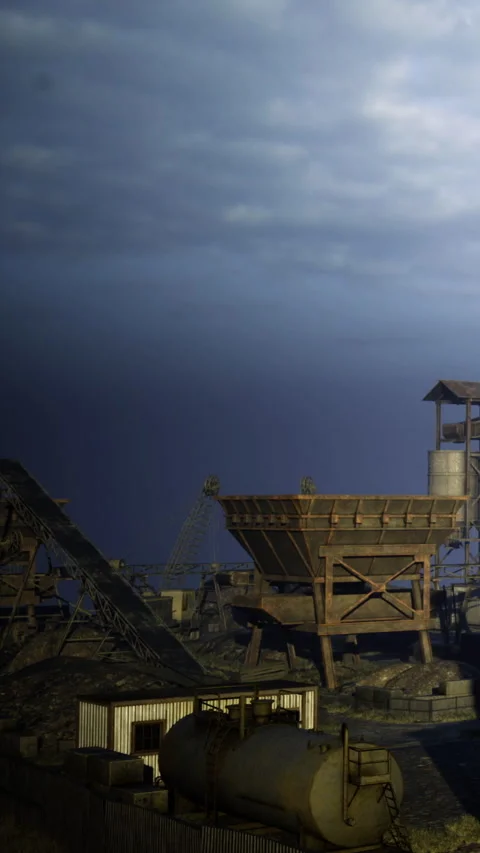Old industrial site with machinery under cloudy sky at dusk Stock Footage 334201826